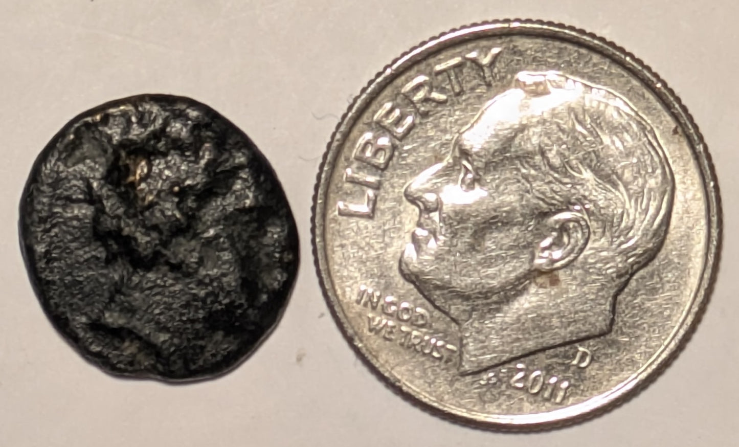 THESSALY, Peumata ~ c. 300-286 BC ~ Æ13 (1.34g) ~ Head of a nymph right, wearing wreath of oak ~ Monogram ~ Thessalian helmet right. Rare, seldom seen locale and coin. ~ SNG Cop-198, Rogers 442. ~ aV