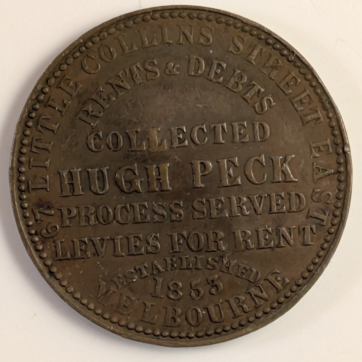 AUSTRALIA, Melbourne, Hugh Peck ~ ND ~ Penny Token ~ Long legends both sides ~ The rarer of two varieties ~ Ren-423, A-433, KM-Tn109 ~ VF, but small dent in center of obverse