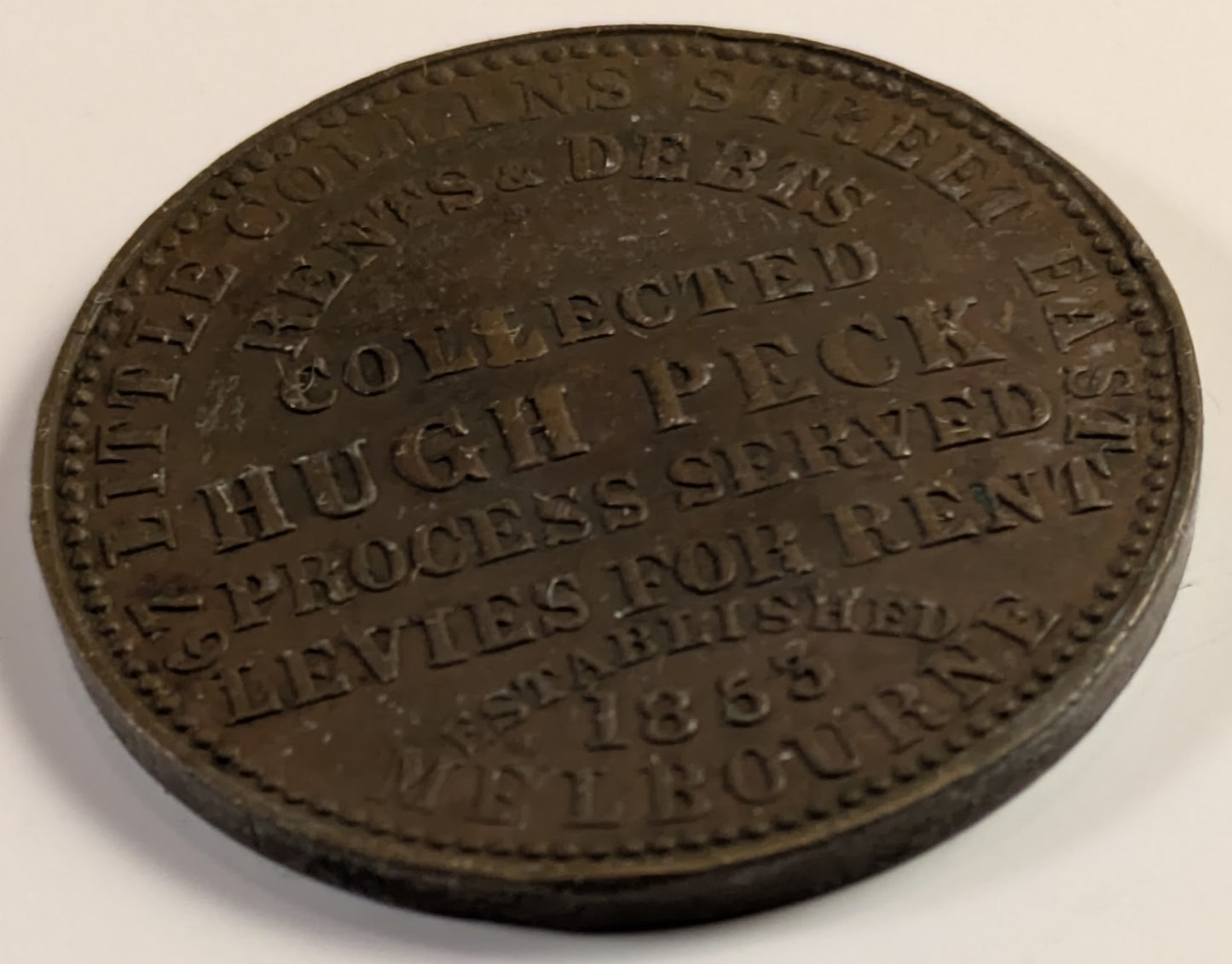 AUSTRALIA, Melbourne, Hugh Peck ~ ND ~ Penny Token ~ Long legends both sides ~ The rarer of two varieties ~ Ren-423, A-433, KM-Tn109 ~ VF, but small dent in center of obverse
