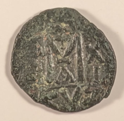 BYZANTINE, Maurice Tiberius ~ 582-602 AD ~ Æ Follis (11.37g) ~ Crowned facing bust. Unusual ending of name VRI. TBERP  ~ Large M, Officina A, year 11, cross above KYZ in ex.. Cyzicus mint ~ SB-518, Ratto-1122 ~ aVF, o.c.