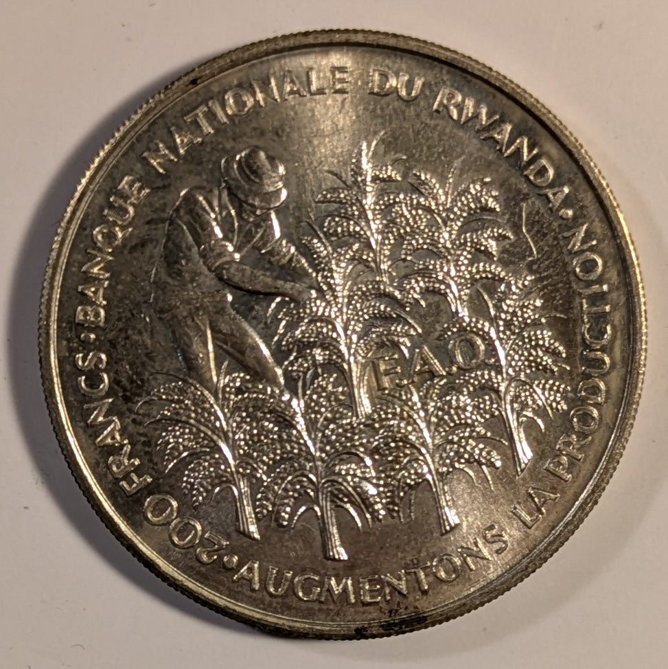 RWANDA, Republic ~ 1972 ~ Silver 200 Francs ~ 10th Anniverary of Independence. Gregoire Kayibanda, flag, dates ~ Figure picking coffee beans, FAO logo ~ Y-7, KM-11 ~ BU