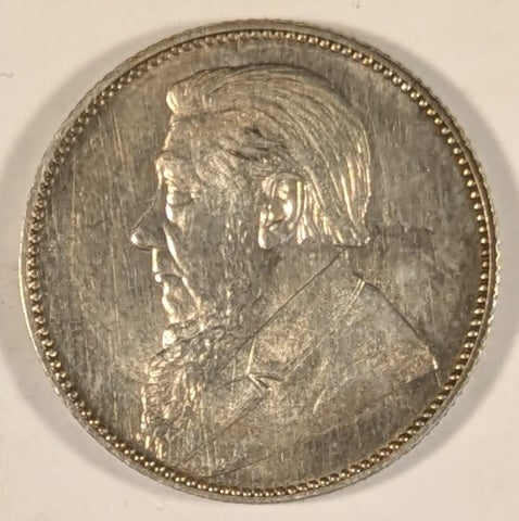 SOUTH AFRICA, Zuid Afrikaansche Republik ~ 1897 ~ Shilling ~ Bust of Paul Kruger left ~ Value divides date in wreath, Z. AFRIK. REP. above.  ~ Y-4, KM-5 ~ Nice unc., a few marks
