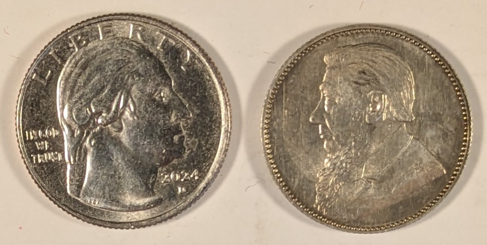 SOUTH AFRICA, Zuid Afrikaansche Republik ~ 1897 ~ Shilling ~ Bust of Paul Kruger left ~ Value divides date in wreath, Z. AFRIK. REP. above.  ~ Y-4, KM-5 ~ Nice unc., a few marks