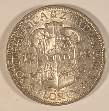 SOUTH AFRICA, Union of So. Africa, Dominion  ~ 1928 ~ 1 Florin ~ Crowned bust of George V left ~ Arms divides date. Denomination as FLORIN.  ~ Y-20, KM-18 ~ EF