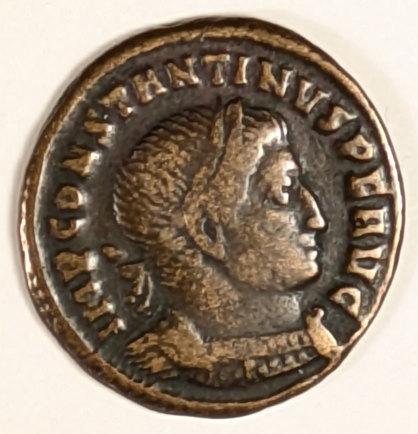 ROME, Constantine I, the Great ~ 307-337 (314-15) ~ Æ Follis 21mm (3.05g) ~ Laureate bust right  ~ Sold standing left holding globe in l. hand, & raising r., star in left field P•T in ex. Ticinum ~ SR-16087, C-356 ~ F/VF
