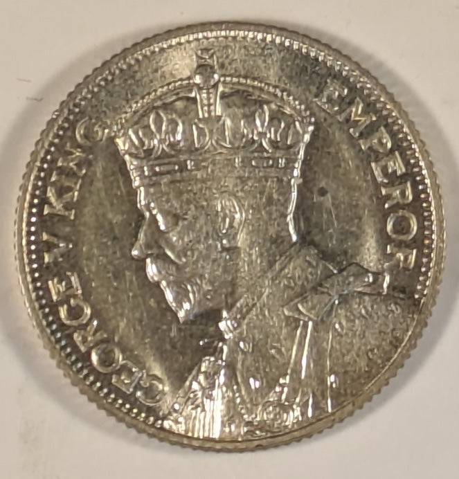 SOUTHERN RHODESIA, British Colony, George V ~ 1932 ~ Shilling ~ Bust of King left ~ Bird Headdress. 1st year of issue ~ Y-5, KM-3 ~ Choice BU, small spot behind head