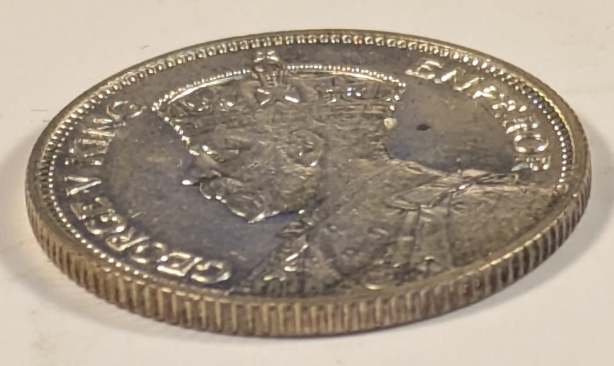 SOUTHERN RHODESIA, British Colony, George V ~ 1932 ~ Shilling ~ Bust of King left ~ Bird Headdress. 1st year of issue ~ Y-5, KM-3 ~ Choice BU, small spot behind head