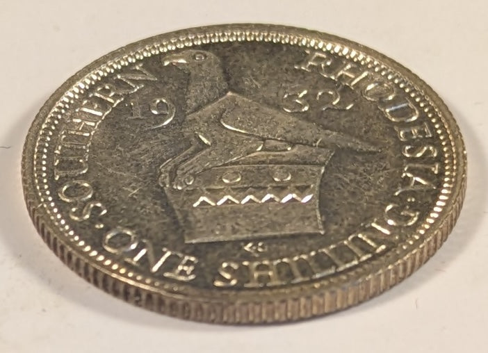 SOUTHERN RHODESIA, British Colony, George V ~ 1932 ~ Shilling ~ Bust of King left ~ Bird Headdress. 1st year of issue ~ Y-5, KM-3 ~ Choice BU, small spot behind head