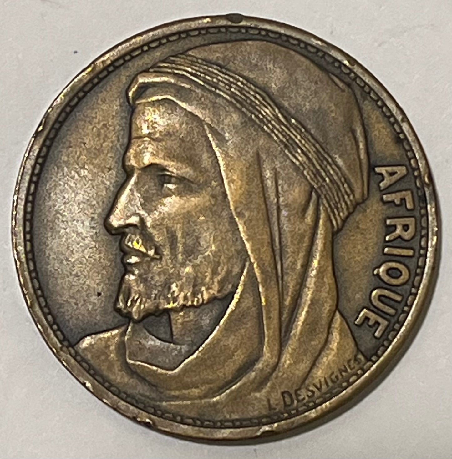 FRANCE, International Colonial Expo (Paris) ~ 1931 ~ Bronze 32mm ~ Head of Africa left "AFRIQUE" by L. Desvignes ~ View of Expo buildings "EXPOSITION COLONIALE INTERNATIONALE 1931" in 4 lines ~ EF, nicks