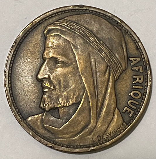 FRANCE, International Colonial Expo (Paris) ~ 1931 ~ Bronze 32mm ~ Head of Africa left "AFRIQUE" by L. Desvignes ~ View of Expo buildings "EXPOSITION COLONIALE INTERNATIONALE 1931" in 4 lines ~ EF, nicks