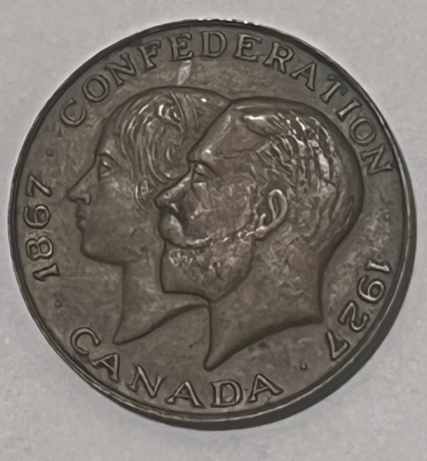 CANADA, 60th Anniversary of Confederation ~ 1927 ~ AE27 ~ Conjoined busts of George V and Mary left ~ Arms ~ TC-234773 ~ EF+