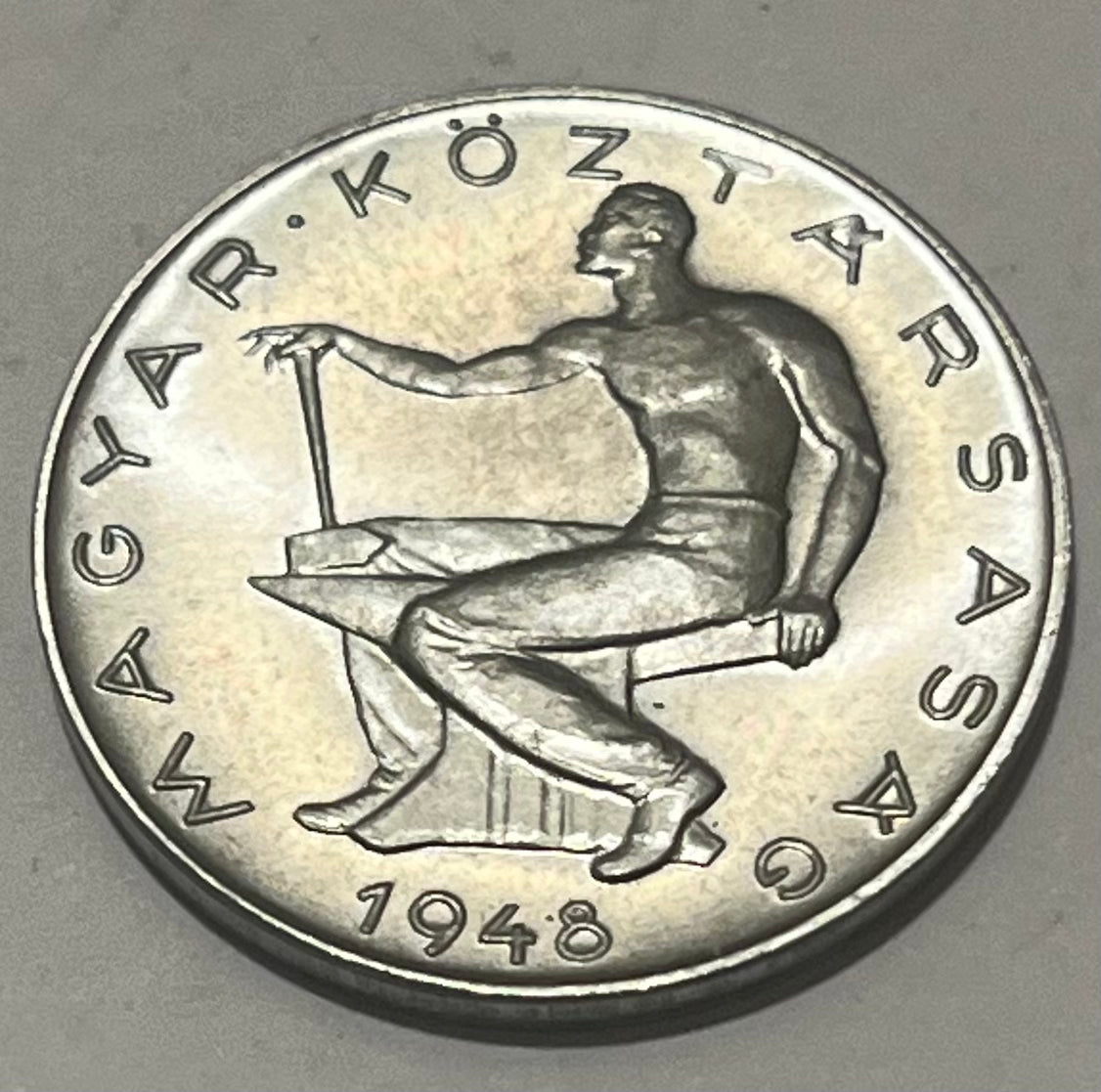 HUNGARY, First Republic ~ 1948 ~ 50 Filler ~ Blacksmith sitting on anvil ~ Denomination within wreath ~ KM-536, Y-62 ~ CH, BU