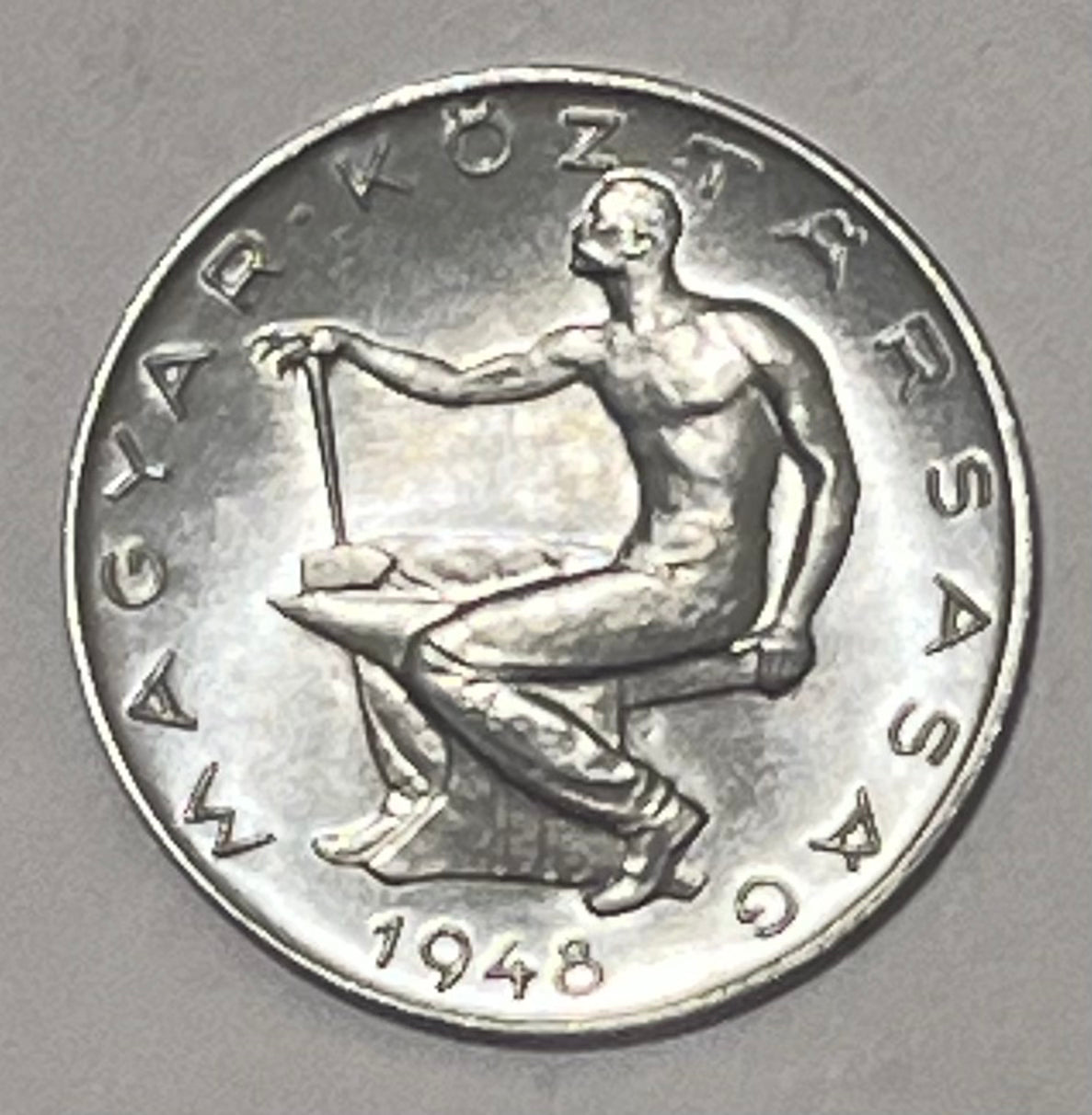 HUNGARY, First Republic ~ 1948 ~ 50 Filler ~ Blacksmith sitting on anvil ~ Denomination within wreath ~ KM-536, Y-62 ~ CH, BU