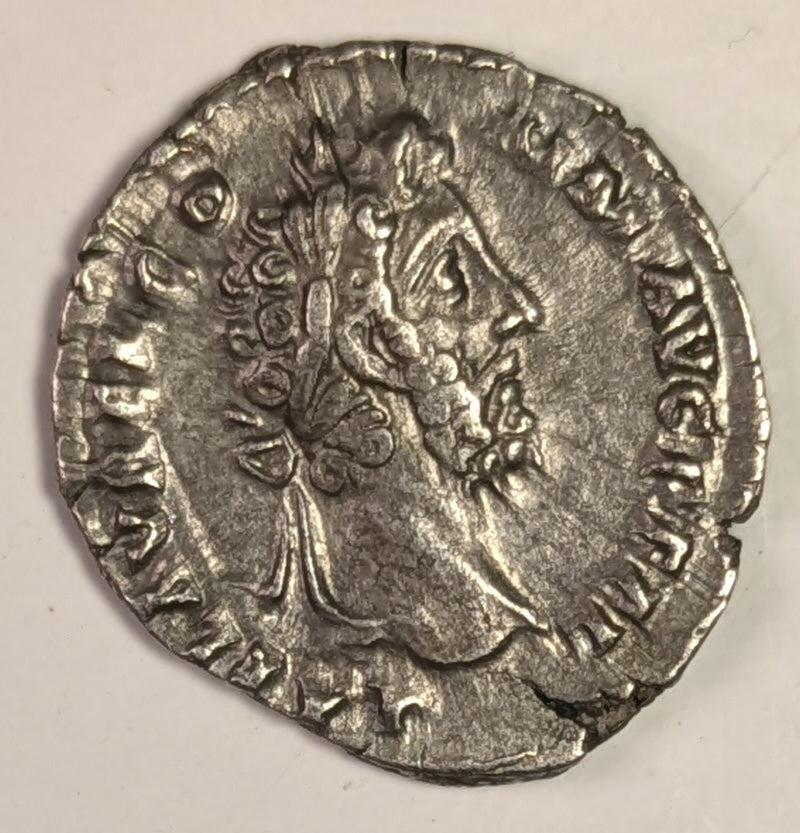 ROMAN EMPIRE, Commodus ~ 177-192 (192) ~ Silver Denarius (2.82g) ~ Laureate, draped bust right L AEL AVREL COMM AVG P FEL ~ Commodus, as Hercules, stg r.,resting club on tree trunk clasping hands with Africa ~ RIC-259a, SR-5687, C-643 ~ aEF