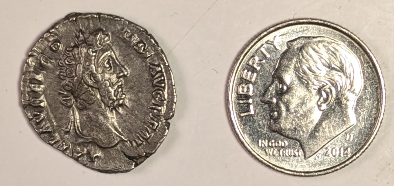 ROMAN EMPIRE, Commodus ~ 177-192 (192) ~ Silver Denarius (2.82g) ~ Laureate, draped bust right L AEL AVREL COMM AVG P FEL ~ Commodus, as Hercules, stg r.,resting club on tree trunk clasping hands with Africa ~ RIC-259a, SR-5687, C-643 ~ aEF