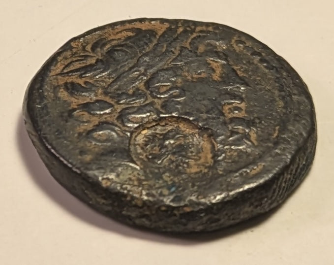 SYRIA, Seleucis & Pieria. Antioch ~ Pseudo-autonomous. 1st century BC ~ Æ Tetrachalkon (23.5mm, 11.07g) ~ Laureate head of Zeus right ~ c/m: head of Cleopatra VII(?) right within oval incuse ~ Zeus Nikephoros seated left ~  VF/aF